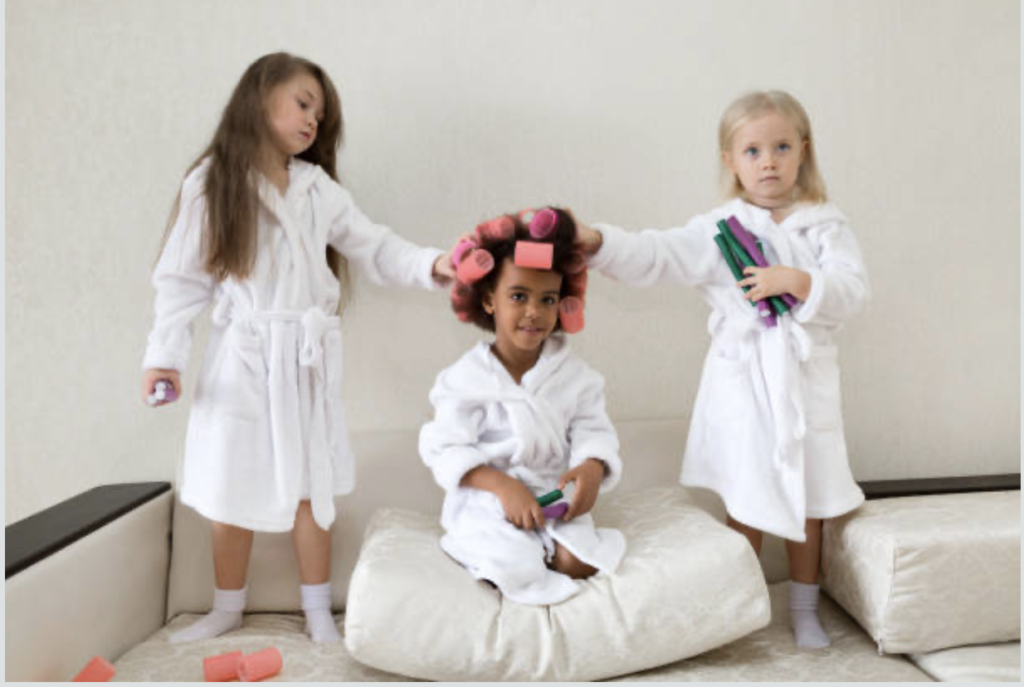 kids spa party in croydon, wearing white robes with hair rollers