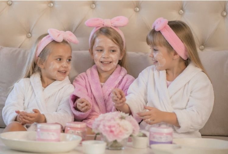 Kids spa party Chelsea London, in pamper robes smiling