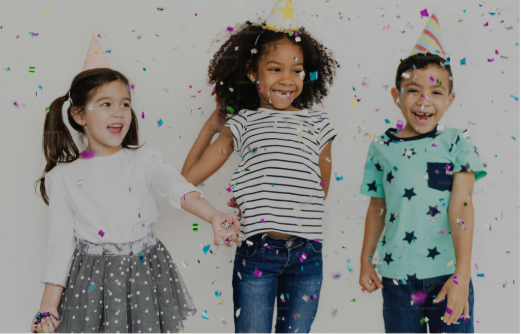 kids birthday pamper party in London, dancing, jumping with confetti in the air